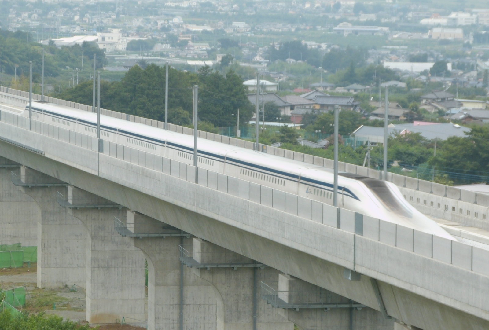 L0 series maglev train of the Chuo Shinkansen test line on a viaduct in Yamanashi